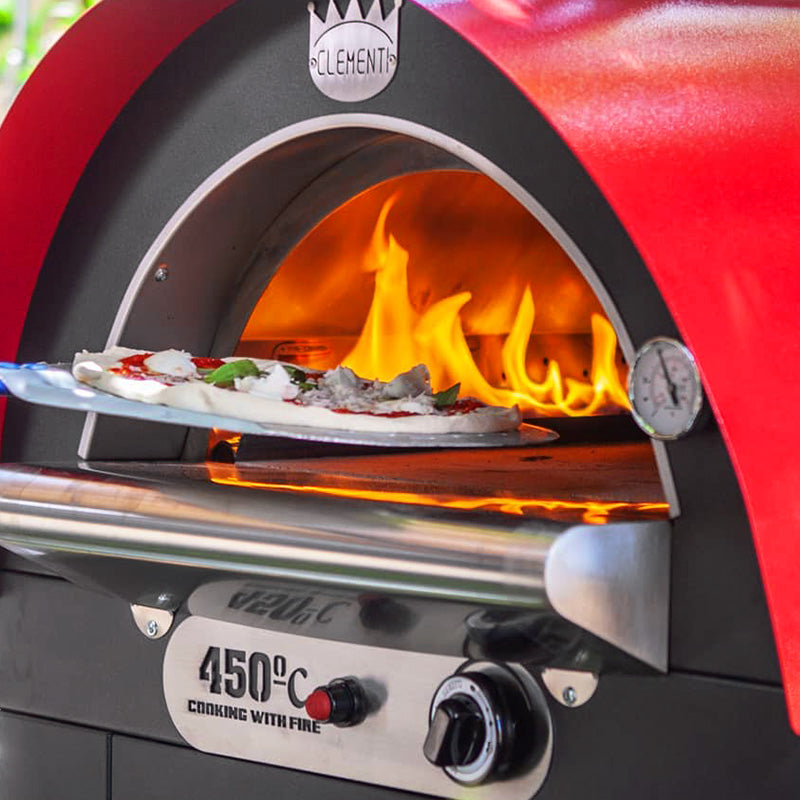 Clementi Original Gas Fired Pizza Oven 100 x 80. Pizza cooking and flames - TheOutdoorGrillCo