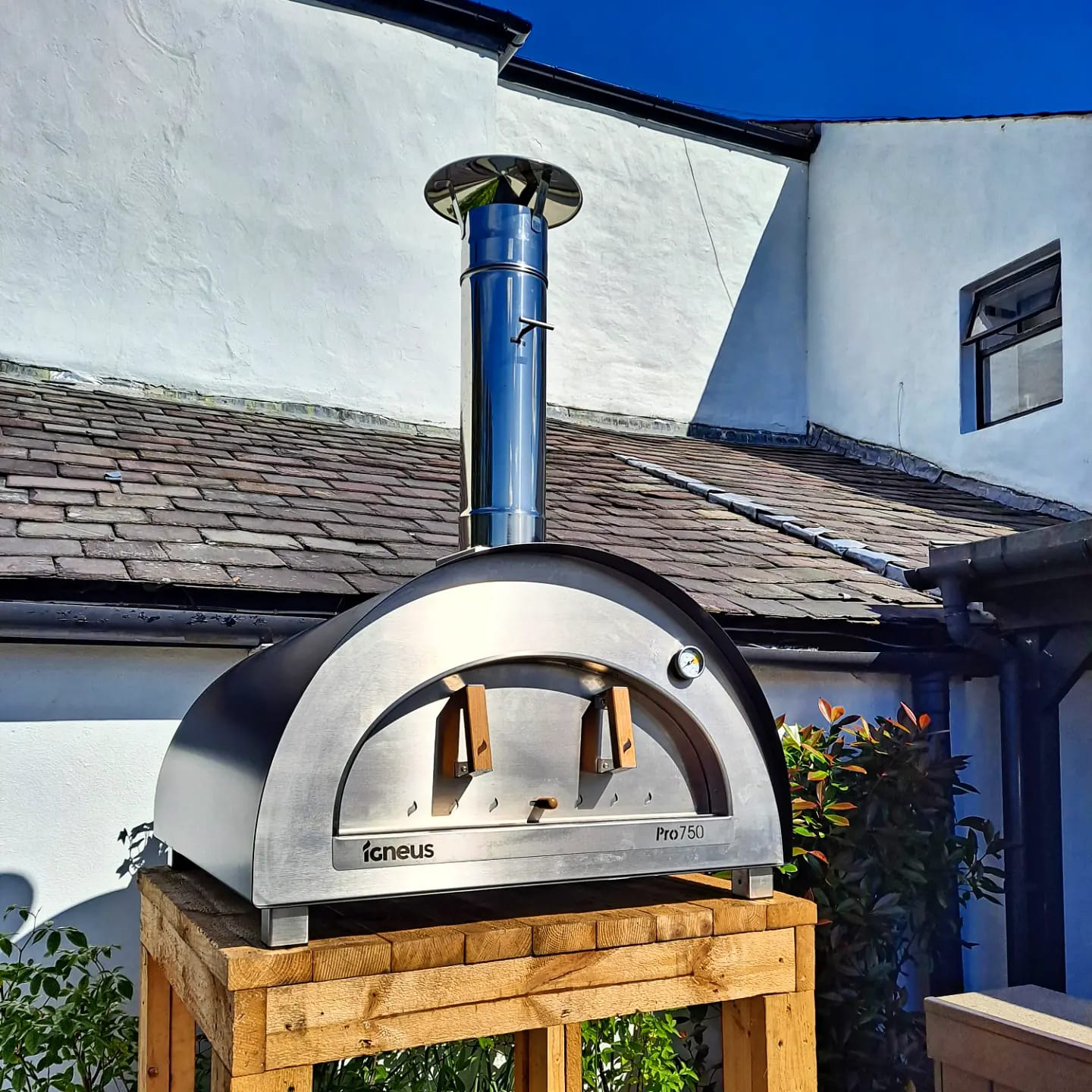 Igneus - Pro 750 Wood Fired Pizza Oven outdoors on a wooden table