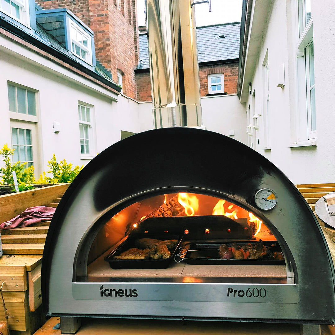 Igneus - Pro 600 Wood Fired Pizza Oven - outside picture all fired up with food trays inside