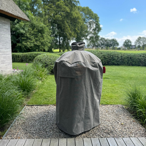Modern Kamado BBQ cover in a garden setting, protecting an outdoor grill – Outdoor Grill Company