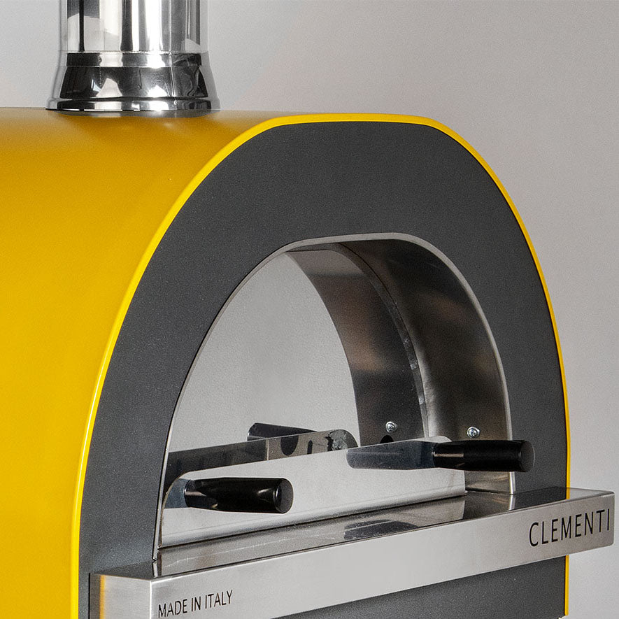 Clementi Gold 100x80 Gas & Wood Fired Pizza Oven Standalone. Product image shown in close up in yellow. Image 5 of 8. From The Outdoor Grill Company. 