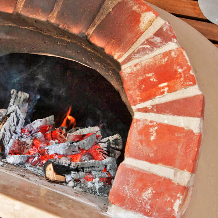 Igneus Ceramiko Pro 1000 Wood Fired Pizza Oven. Lifestyle Shot.  The Outdoor Grill Company.