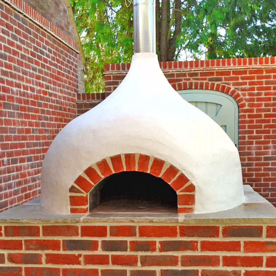 Igneus Ceramiko Pro 1000 Wood Fired Pizza Oven. White finished lifestyle shot.  The Outdoor Grill Company.