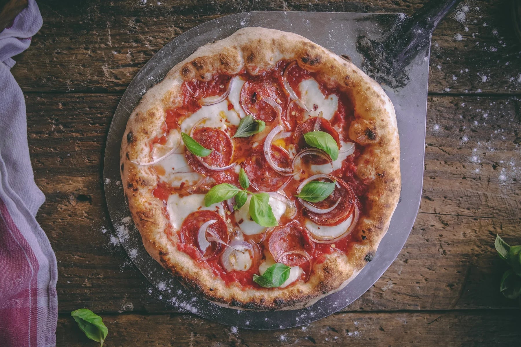Photo of a pizza. The Outdoor Grill Company.